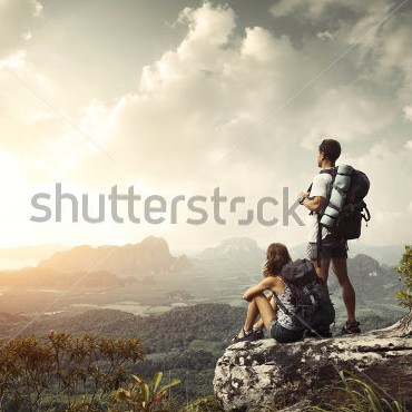 stock-photo-hikers-with-backpacks-enjoying-valley-view-from-top-of-a-mountain-115313584